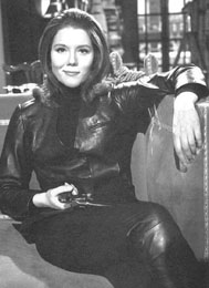 ./Emma Peel - enleathered and seated with pistol - emmapeel.jpg
